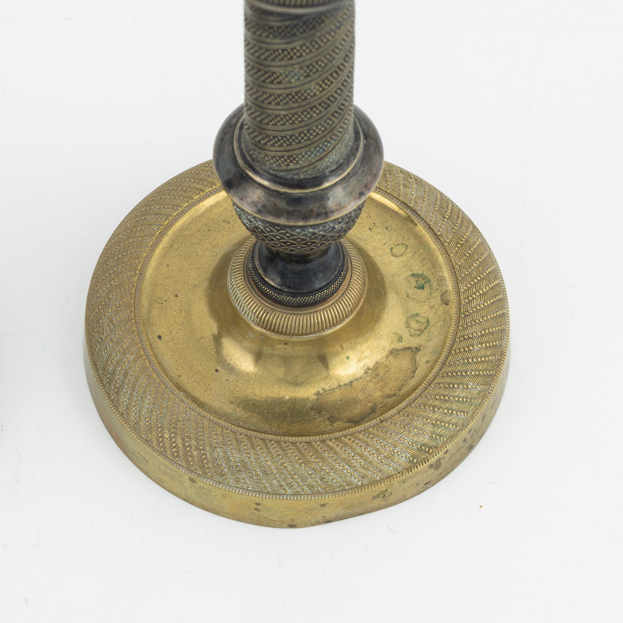 A pair of bronze Empire style candlesticks, 20th Century with older parts.