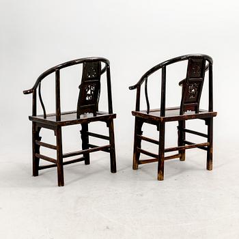 A pair of Chinese hardwood armchairs, circa 1900.