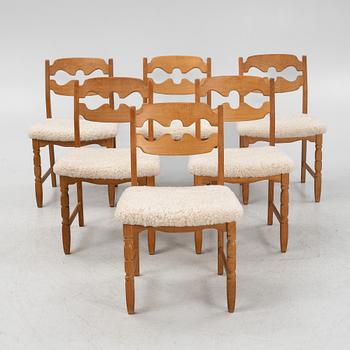 Henning Kjærnulf, a set of six oak 'razorblade' chairs, with new sheepskin upholstery, for EGK, 1960s.