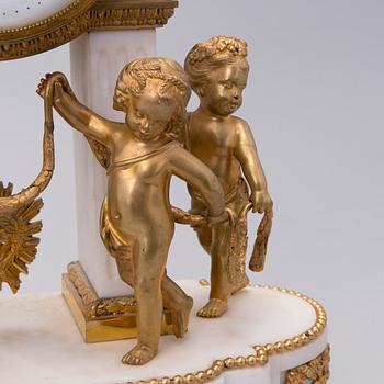 A neoclassical, French mantel clock, ca 1840-1860.