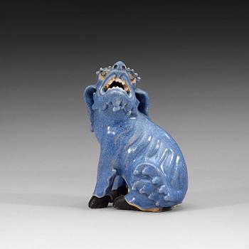 280. A blue glazed figure of a buddhist lion, Qing dynasty, Qianlong (1736-95).