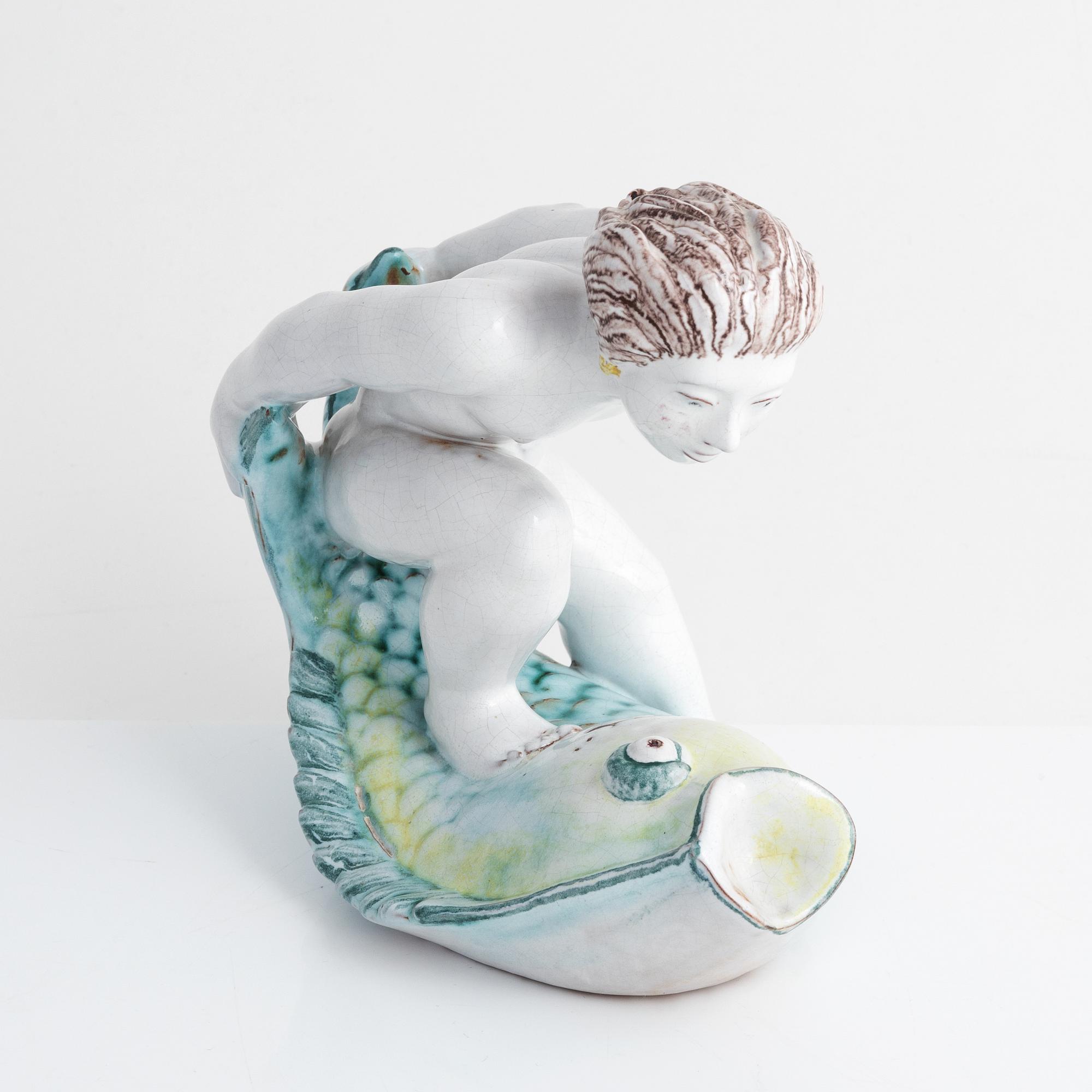 Tyra Lundgren, a faience figurine, Rörstrand, dated -30.