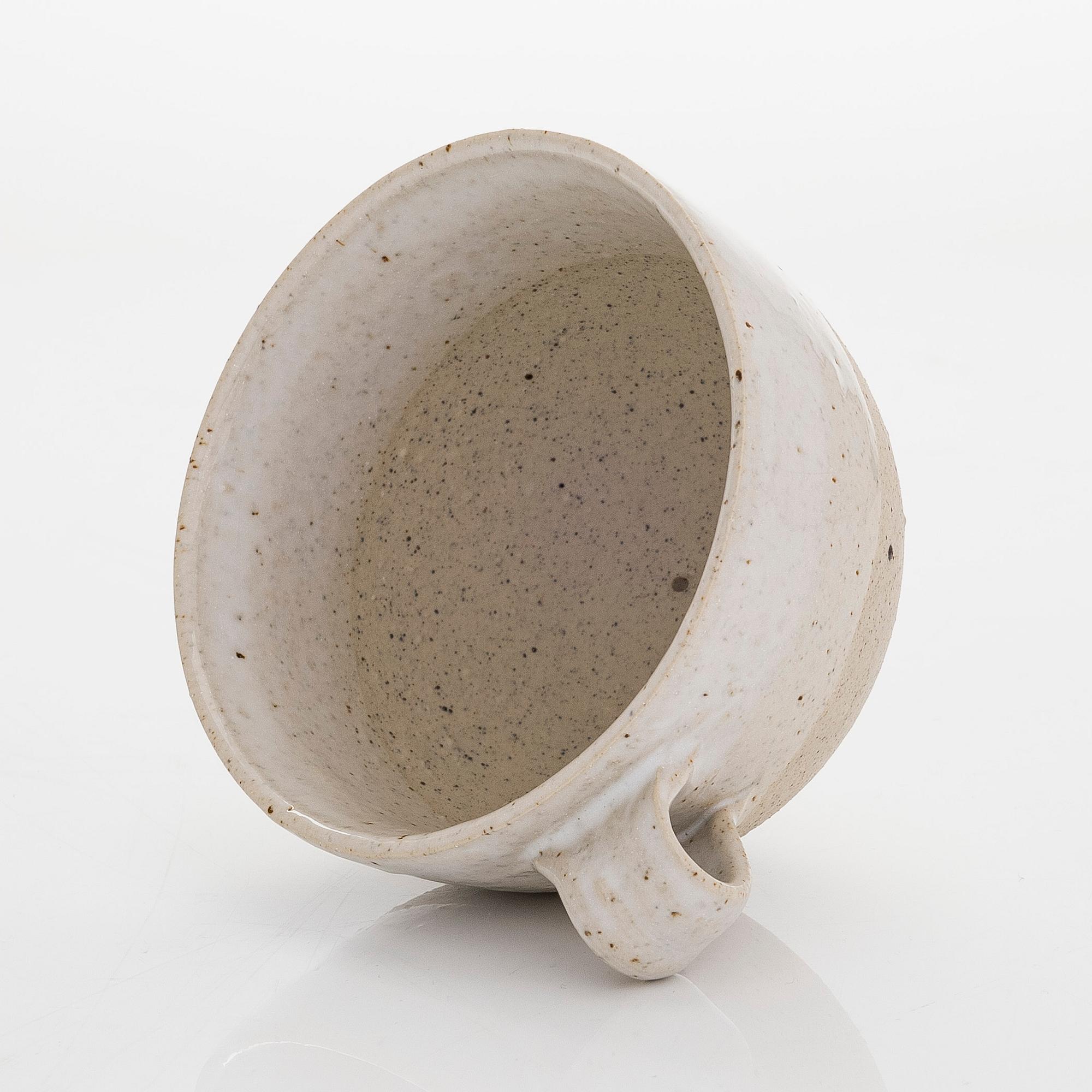 Kyllikki Salmenhaara, a stoneware tea strainer signed KS.