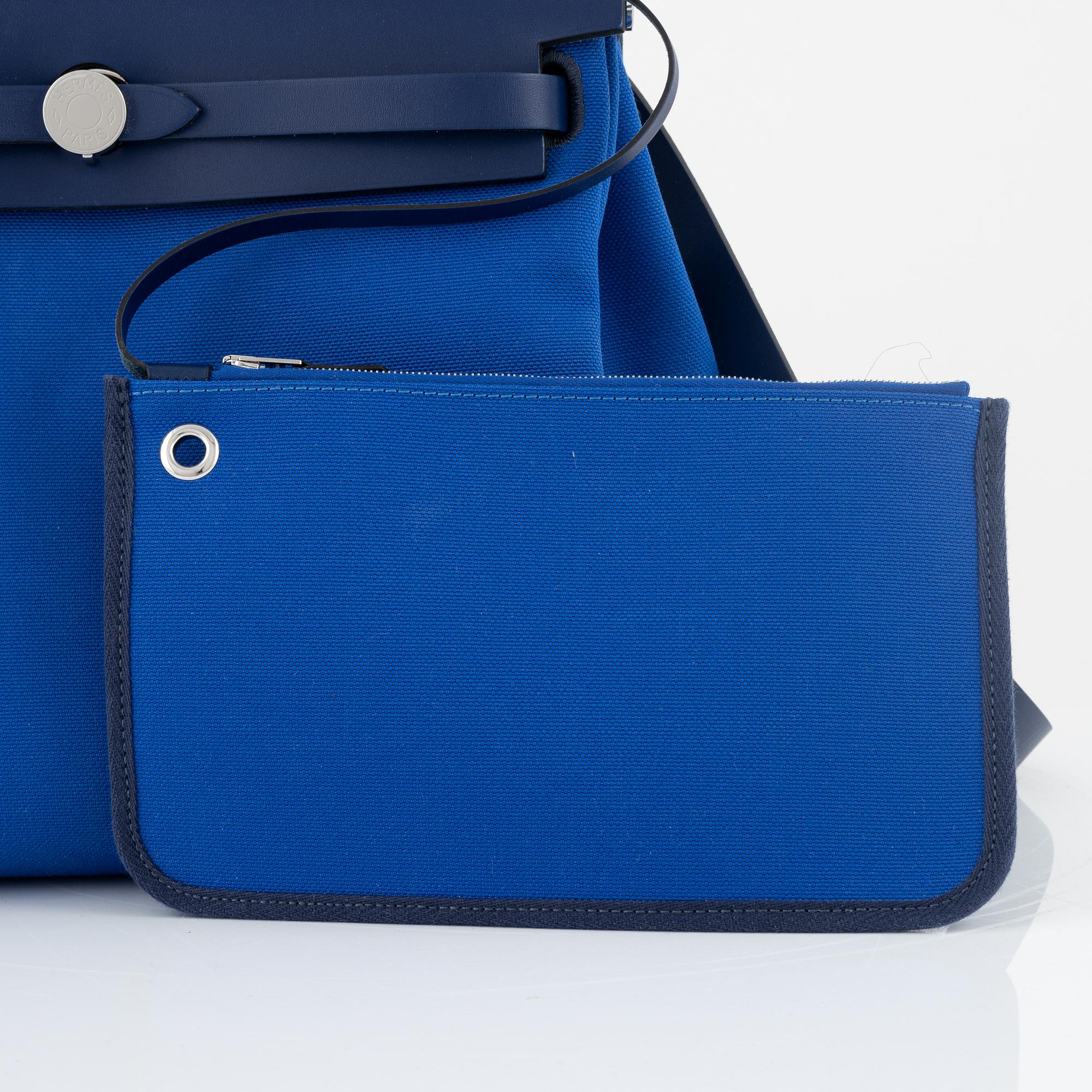 Hermès, a 'Herbag Zip 31' handbag in Bleu Saphir Hunter leather and Bleu Billard military canvas, 2021.