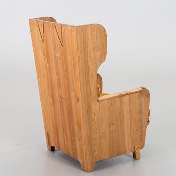 Axel Einar Hjorth, a "Lovö" stained pine armchair, Nordiska Kompaniet, Sweden, 1930's.