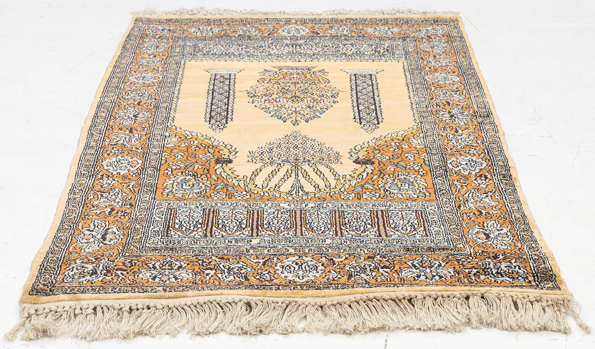 A silk Quum rug, c. 125 x 75 cm.