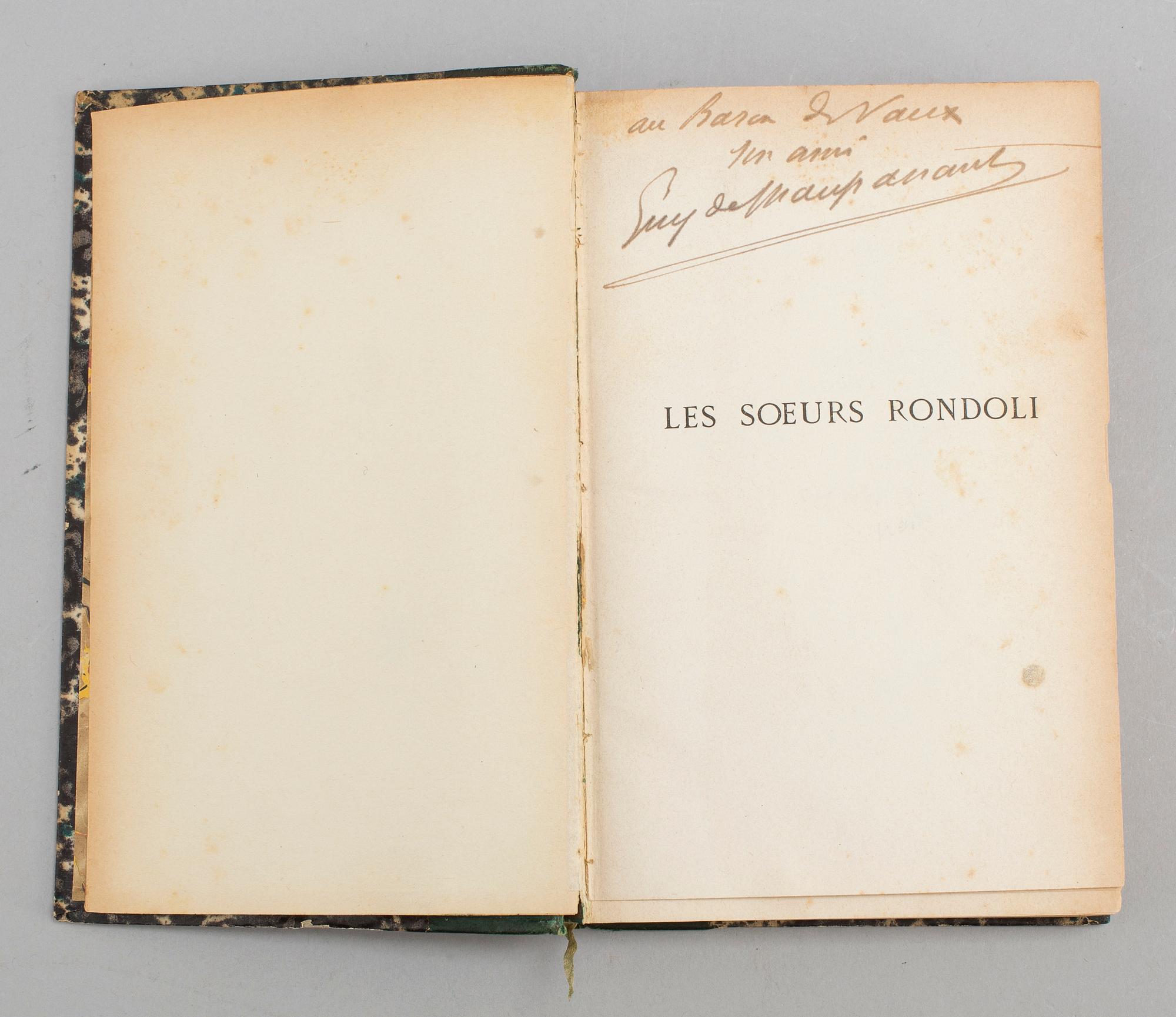 BOOK, inscribed by Maupassant.