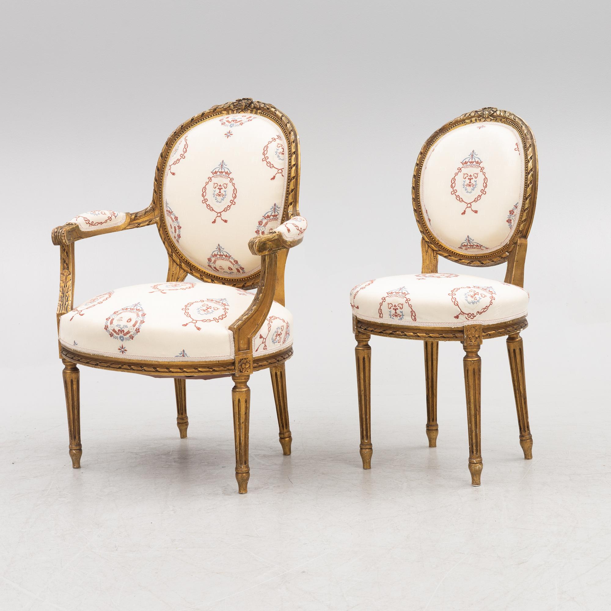 A Gustavian style sofa with two armchairs and two chairs, 20th century.