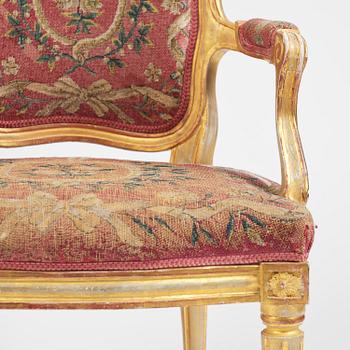 A pair of Gustavian giltwood open armchairs, Stockholm, late 18th century.