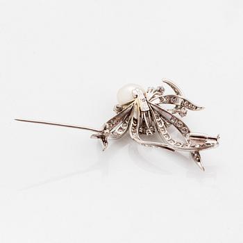 A WA Bolin brooch in platinum set with a pearl and round brilliant- and eight-cut diamonds.