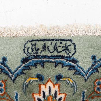 A Keshan carpet, signed, c. 376 x 270 cm.