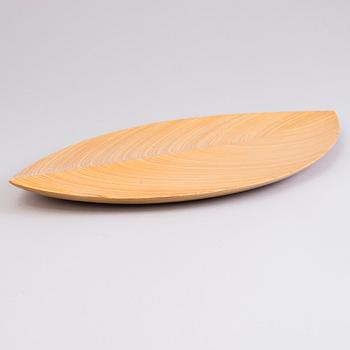 A plywood dish signed TW.