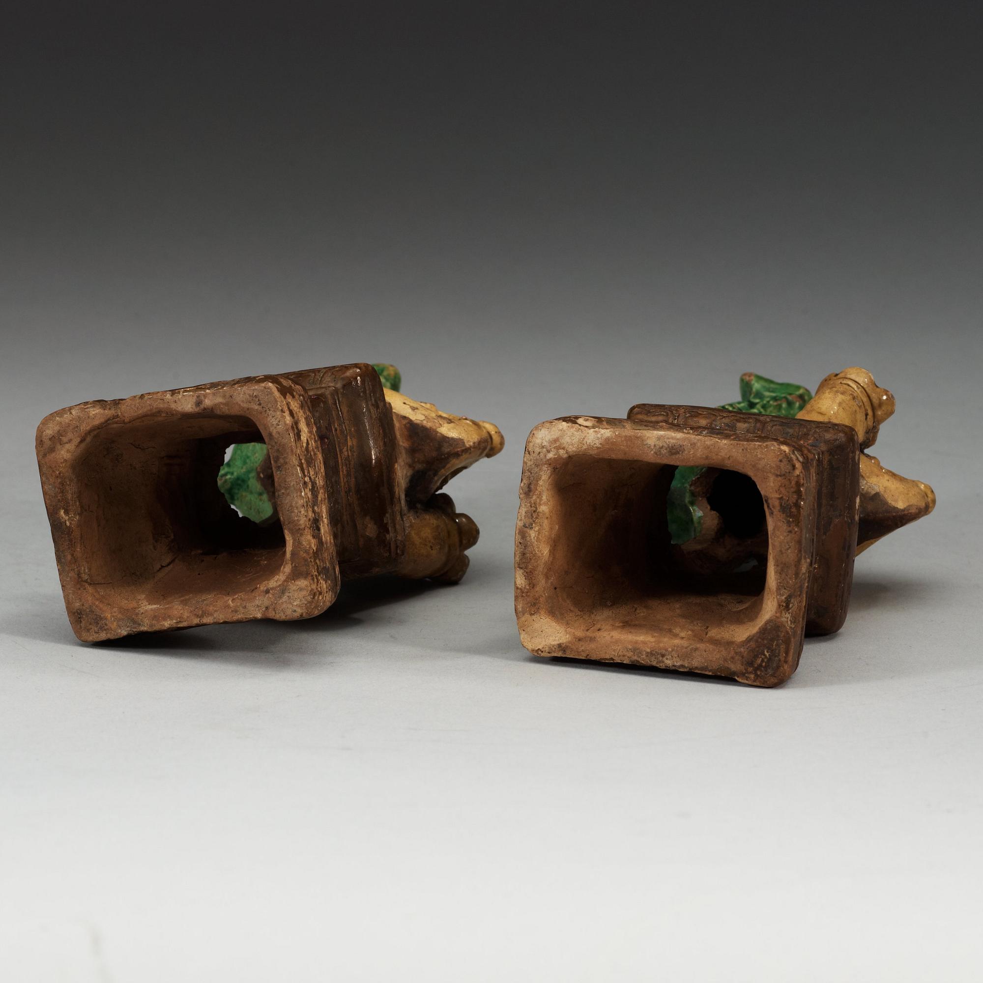 A pair of brown, green and yellow glazed joss stick holders, Qing dynasty (1644-1912).