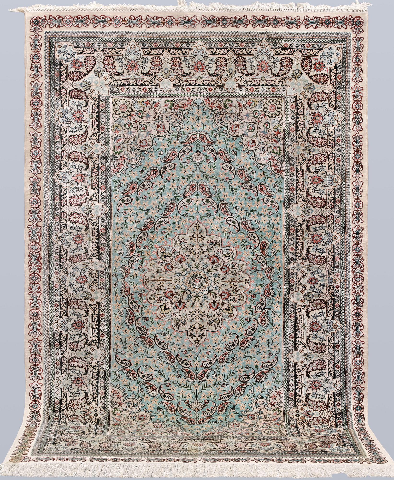 An Oriental silk rug, approx. 154 x 91 cm.