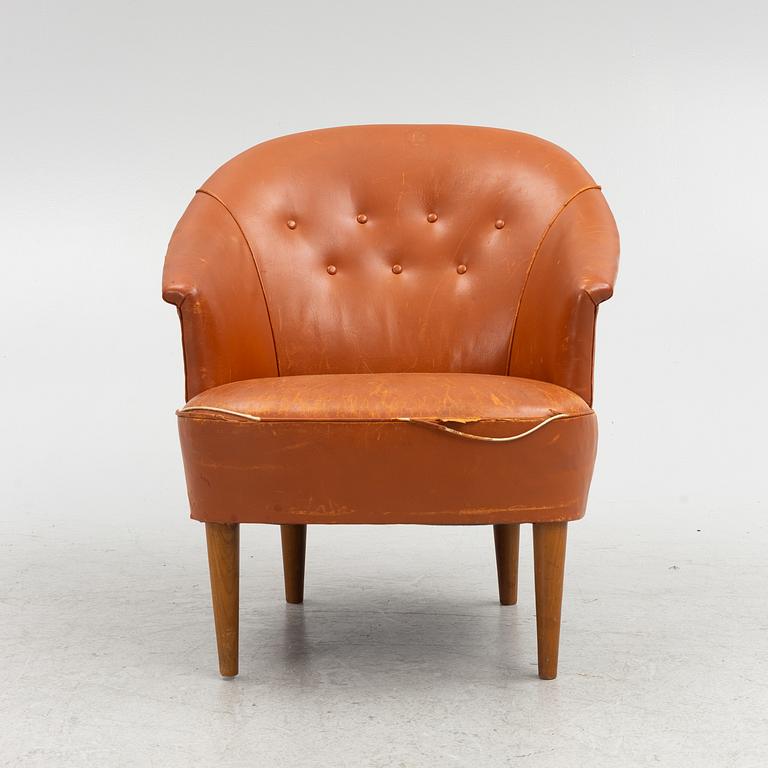 Carl Malmsten, A leather upholstered armchair, model "Lillasyster", O.H. Sjögren, second half of the 20th century.