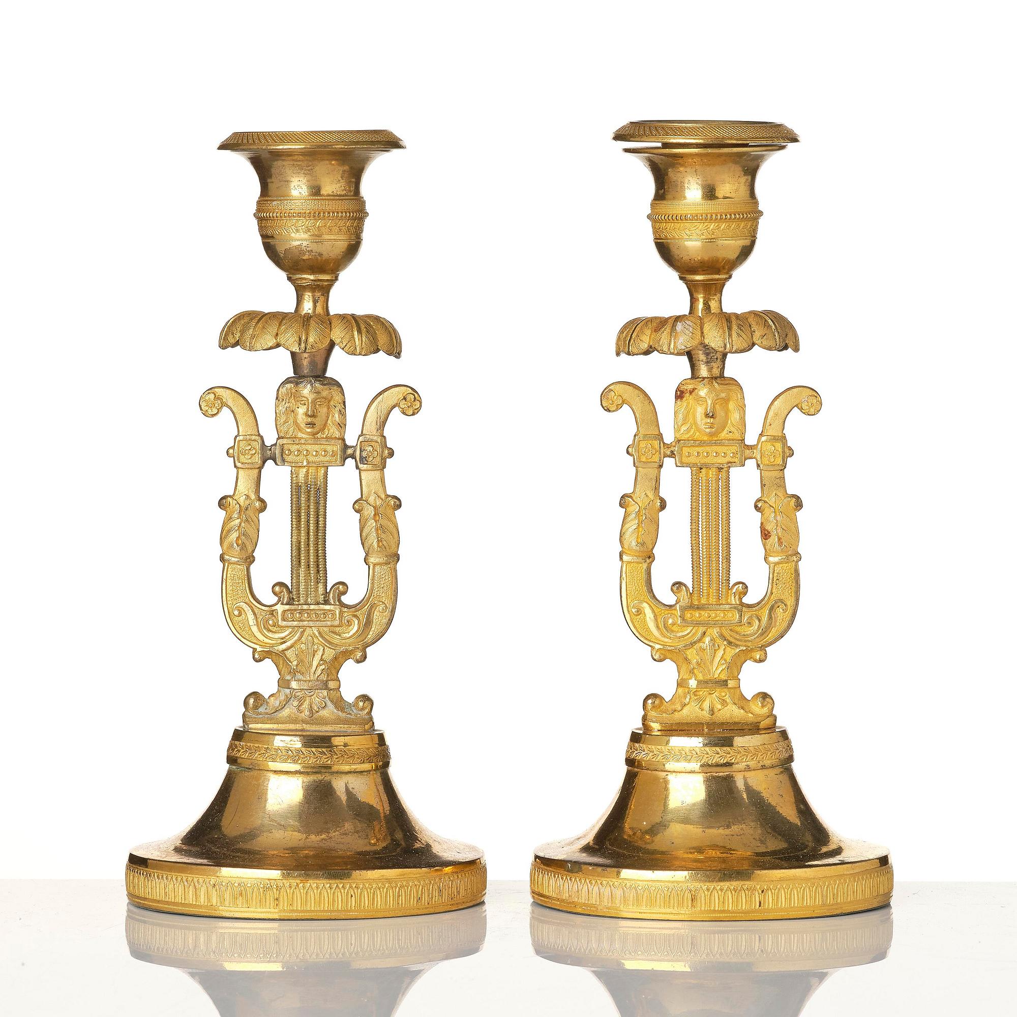 A pair of Swedish Empire ormula candlesticks.