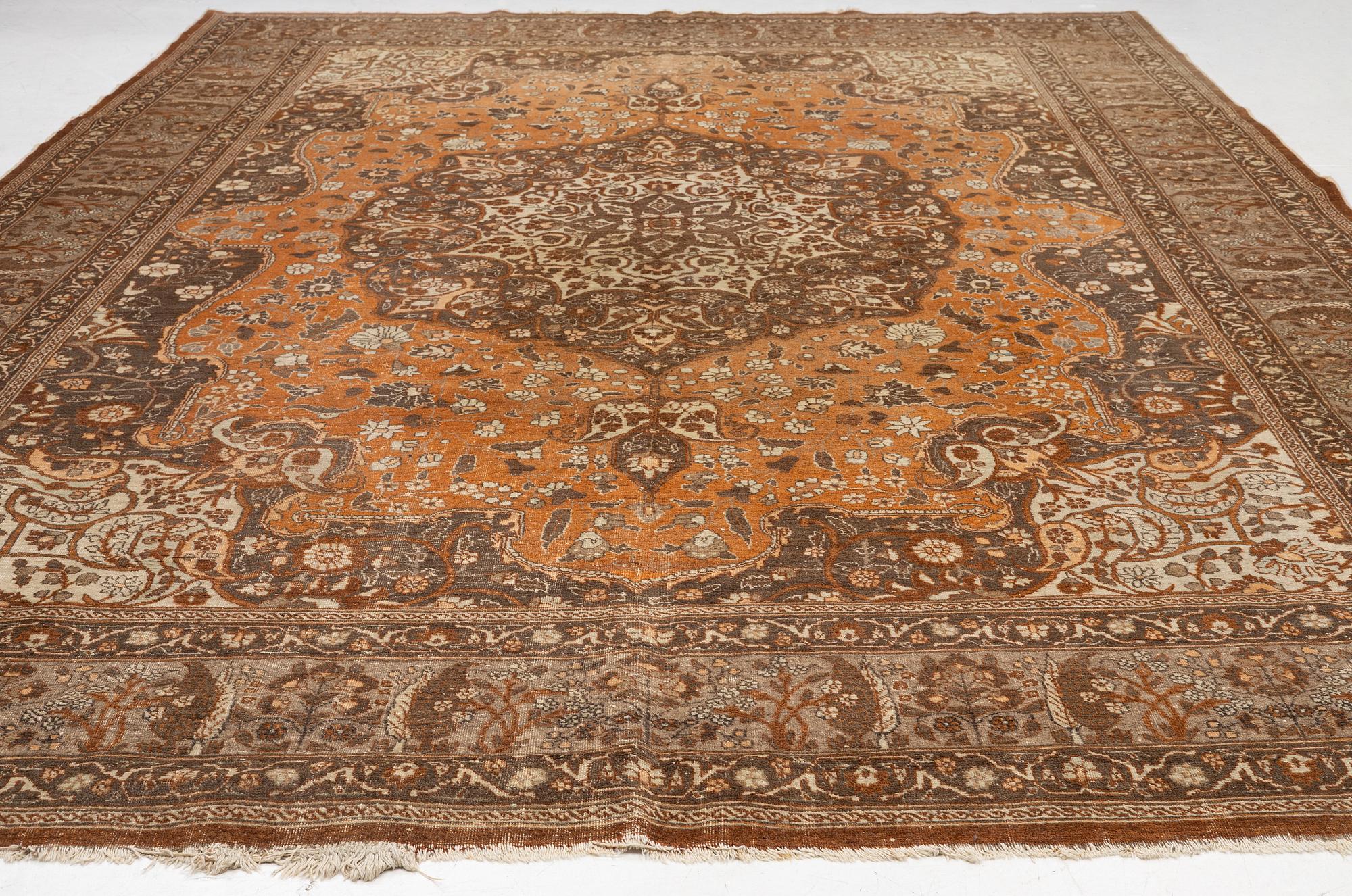 An antique Tabriz carpet, Northwest Persia, 453 x 310 cm.