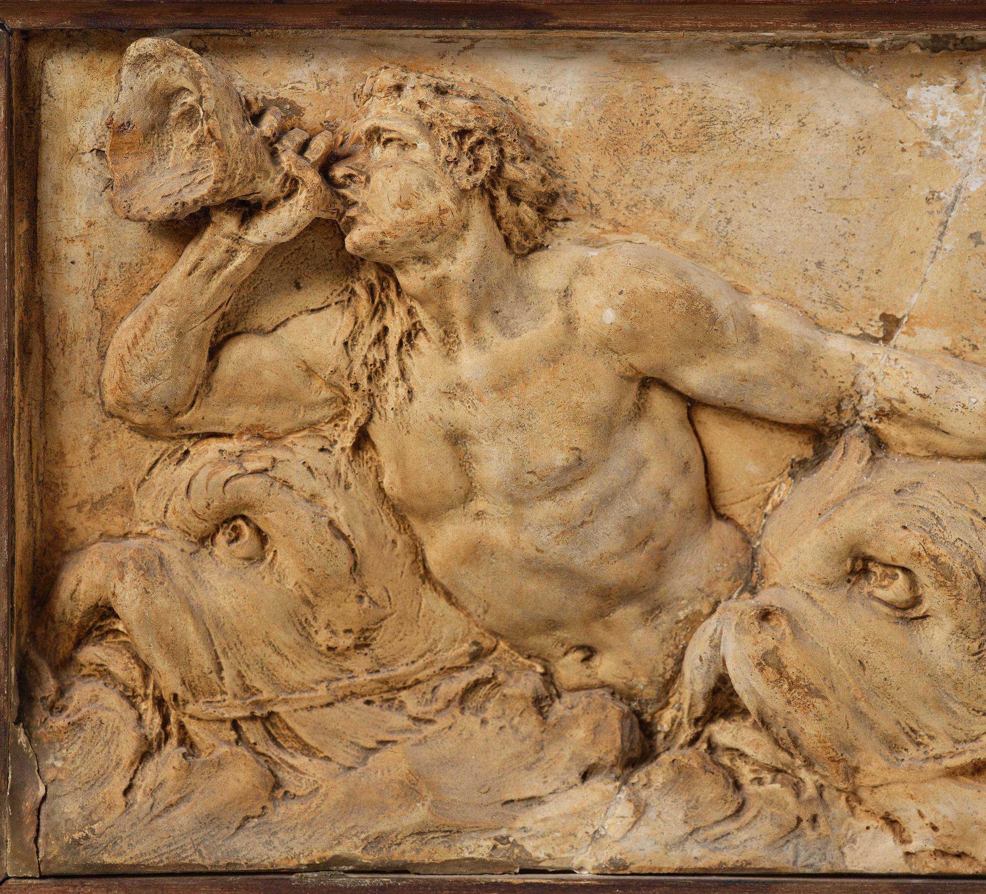 Claude Michel Clodion, attributed to, A relief depicting a nereid riding a dolphin alongside a triton blowing into a conch.