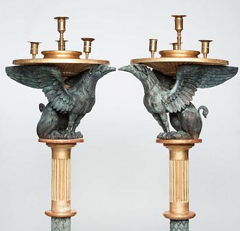 A pair of late Gustavian candle stands, early 19th century.