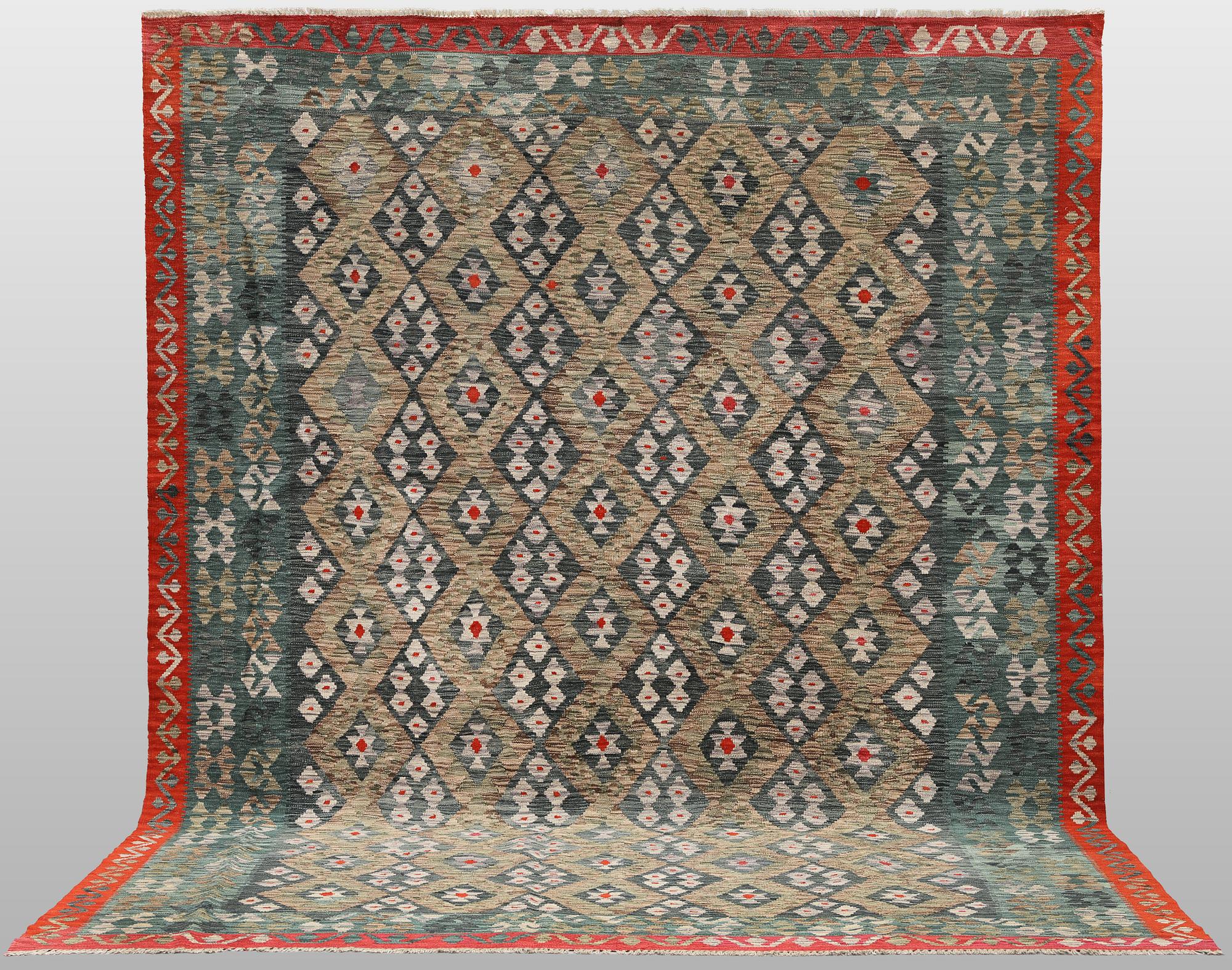 A Kilim carpet, approx. 340 x 262 cm.