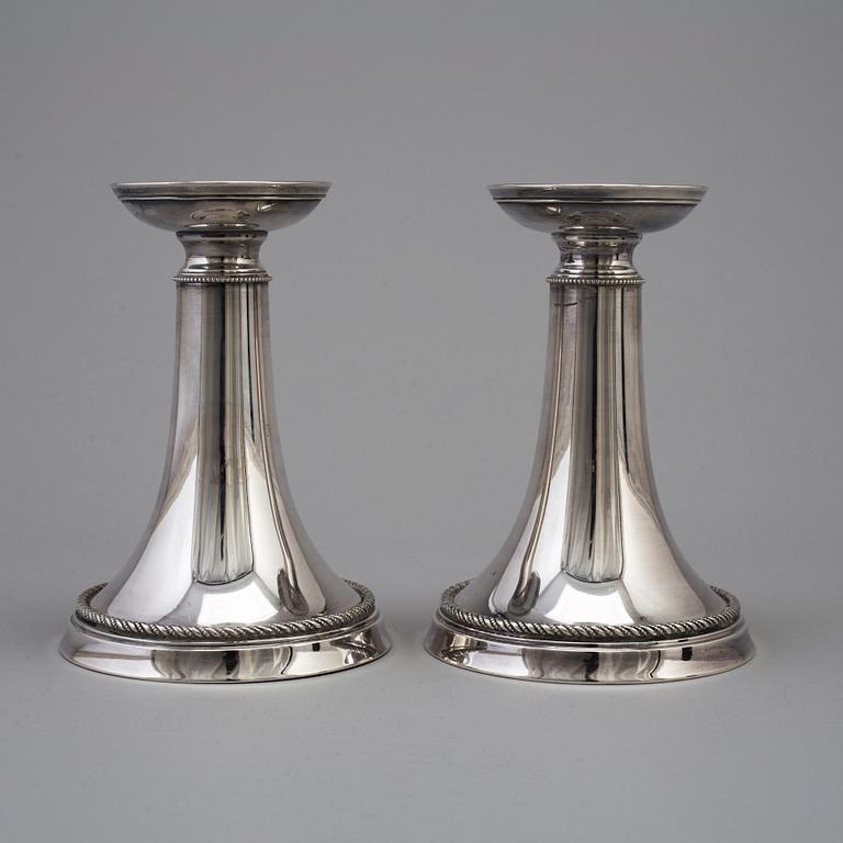 A pair of silver candlesticks by GAB, dated 1953.