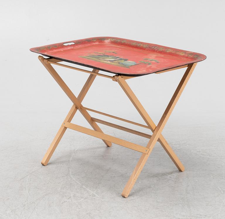 A painted 19th Century tin tray with later stand.