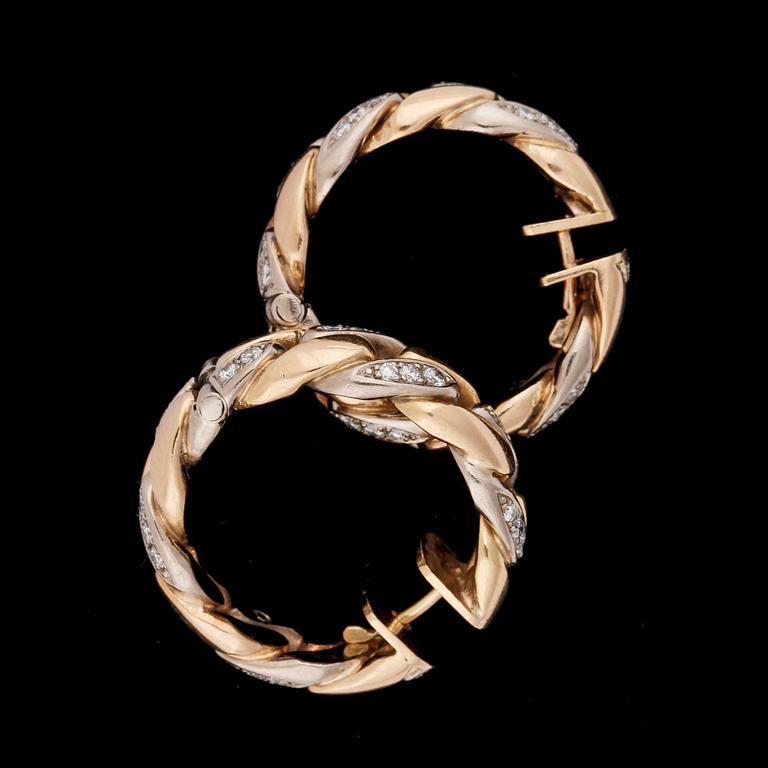 A pair of gold and brilliant cut diamond earrings, tot. app. 0.90 cts.