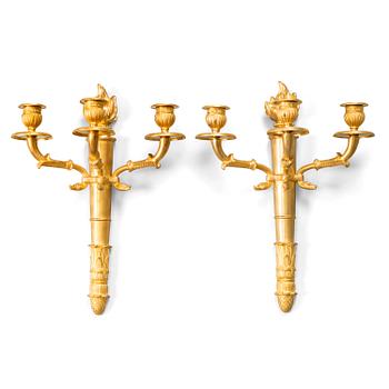 A pair of Empire wall candelabras in gilt bronze from the late 19th century.