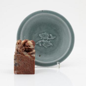 A celadon dish, for the south east asian market, double fish, Mingstyle, 20th Century. And a Chinese sealstone.