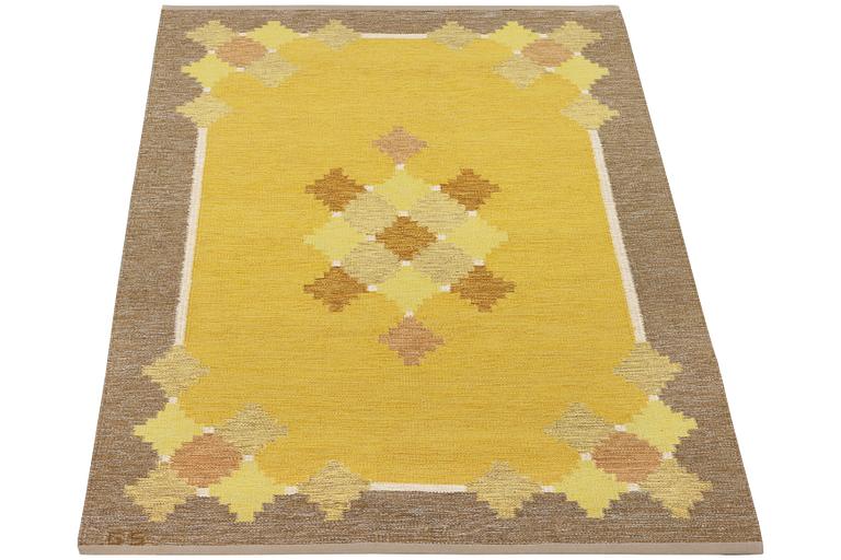 A flat weave carpet, signed GS, c. 205 x 139 cm.