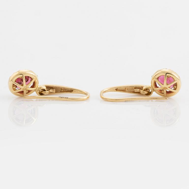 Pink tourmaline and brilliant cut diamond earrings.