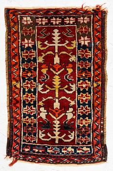 An Antique Milas Yastik rug, Muğla region, c. 84 x 54 cm.