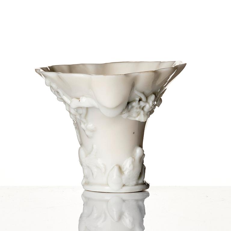 A blanc de chine rhinoceros libation cup, Qing dynasty, Kangxi (1662-1722).