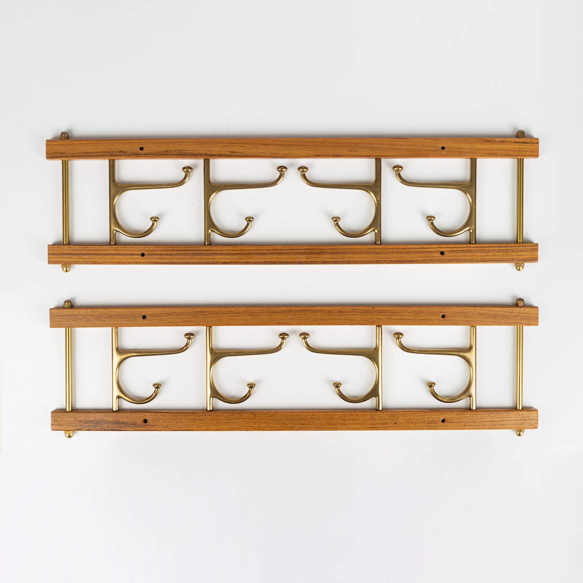A pair of 'Dekorativ' teak coat hangers, Skoglunds metallgjuteri, Anderstorp, 1950's/60's.