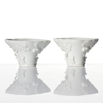 Two blanc de chine rhinoceros libation cups, Qing dynasty, Kangxi (1662-1722).