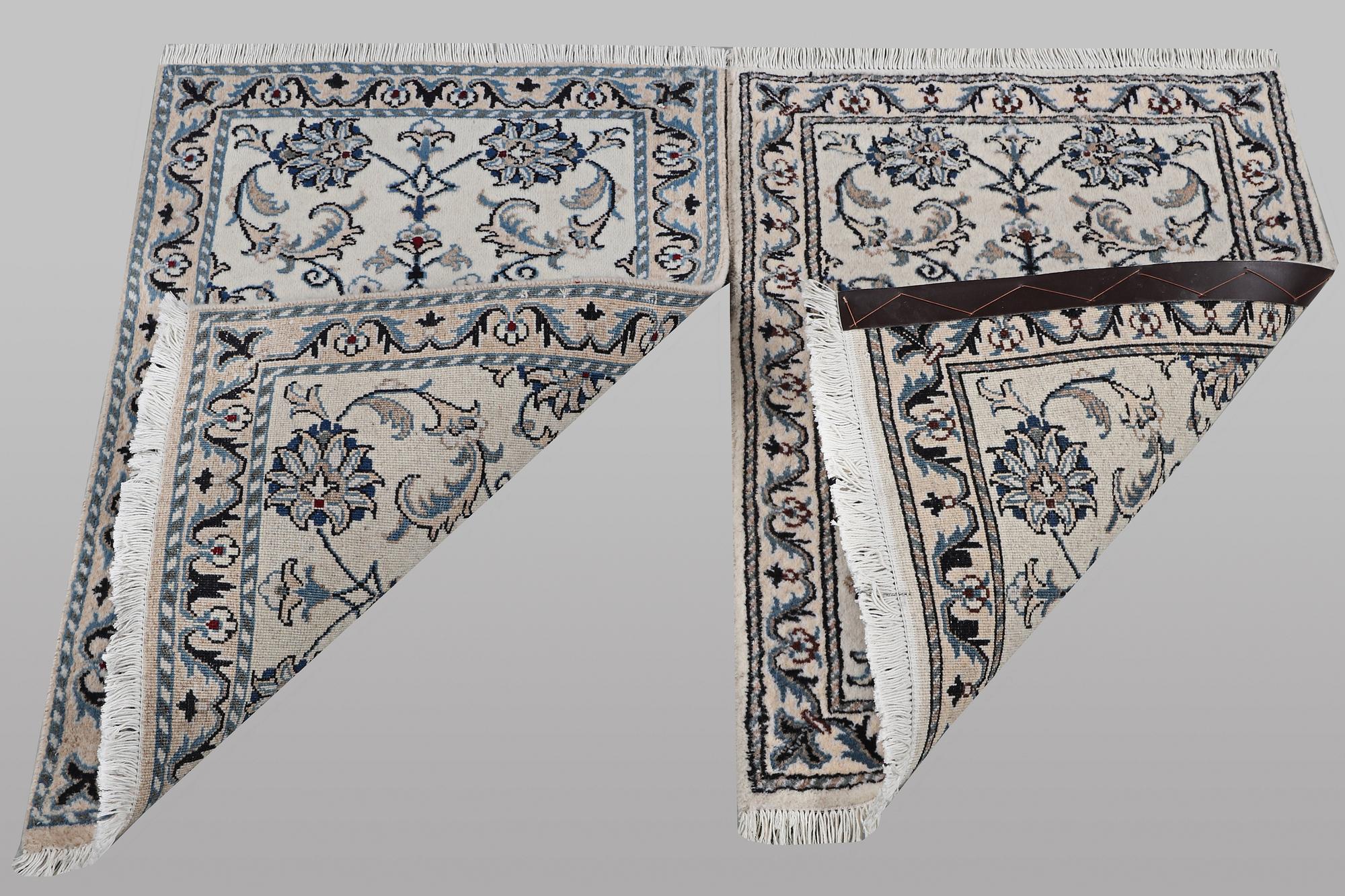 A pair of rugs, Nain, part silk, ca 80 x 60 cm 
 & ca 83 x 58 cm.