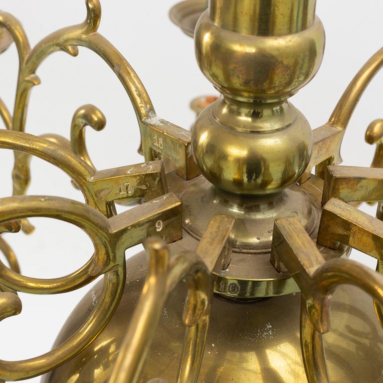 A baroque-style eighteen-branch brass chandelier, late 19th century.