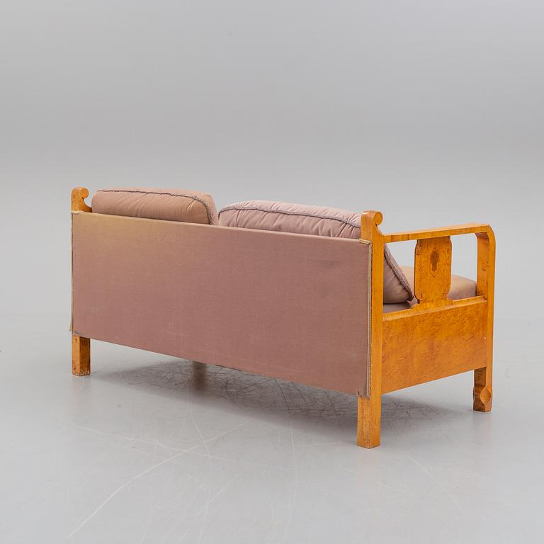 a sofa by NK Stockholm in the 1930's.