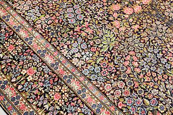 A Kerman Laver carpet, 'Millefleur', approx. 388 x 300 cm.