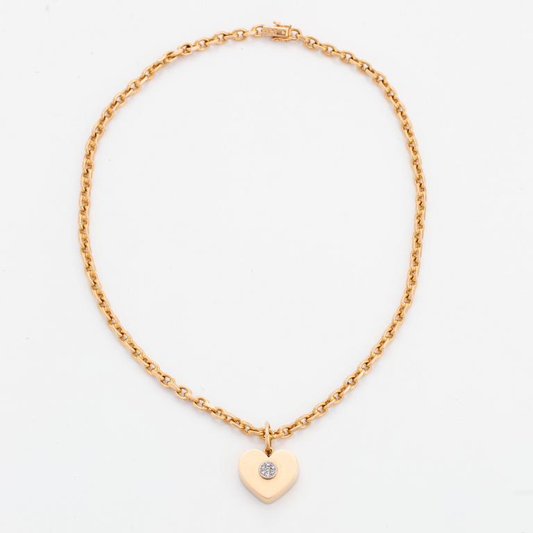 18K gold heart pendant with chain.