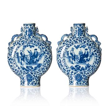 1344. A pair of blue and white moon flasks, Qing dynasty, 19th century.