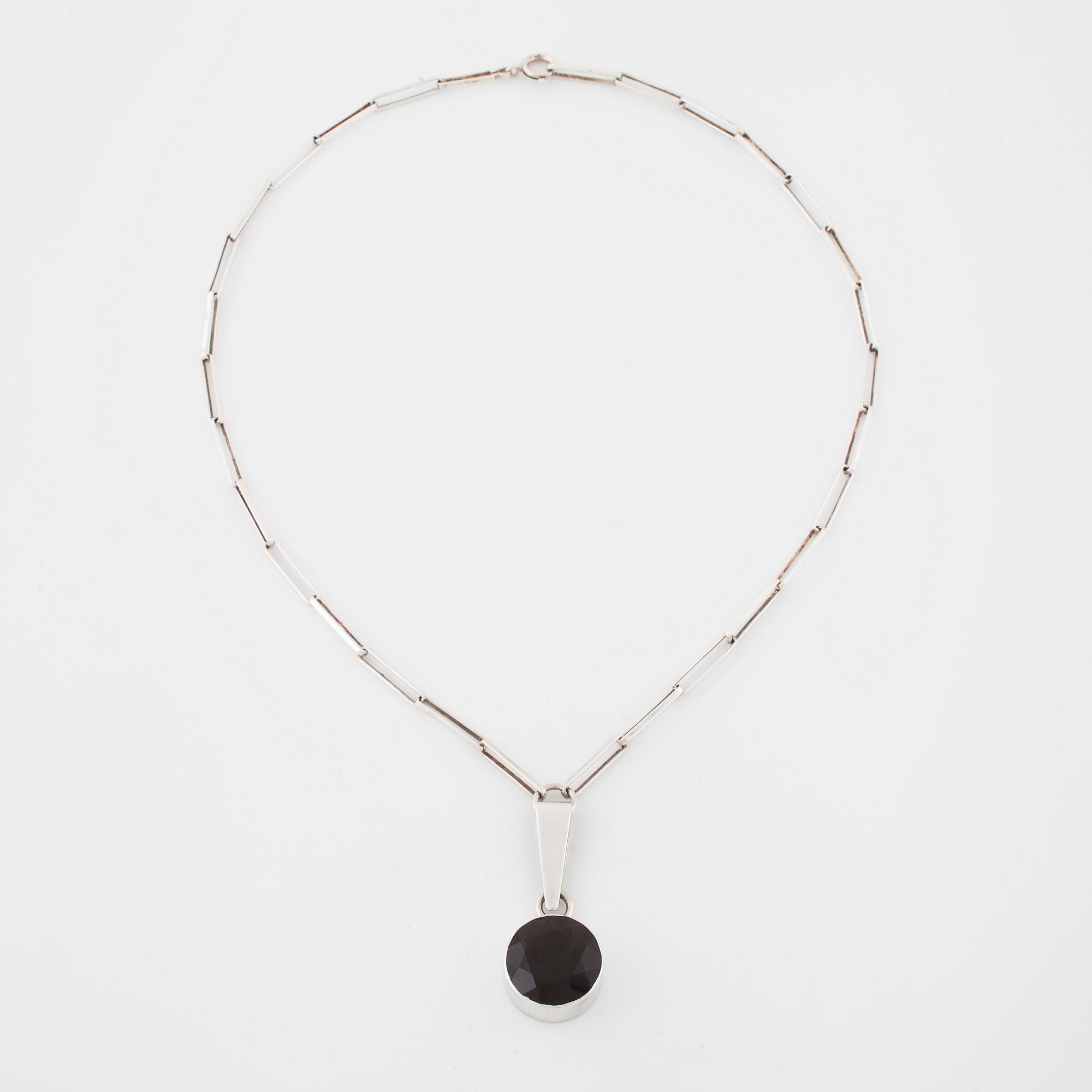 GERT THYSELL, Gussi, Malmö, 1967, a faceted smoky quartz pendant.