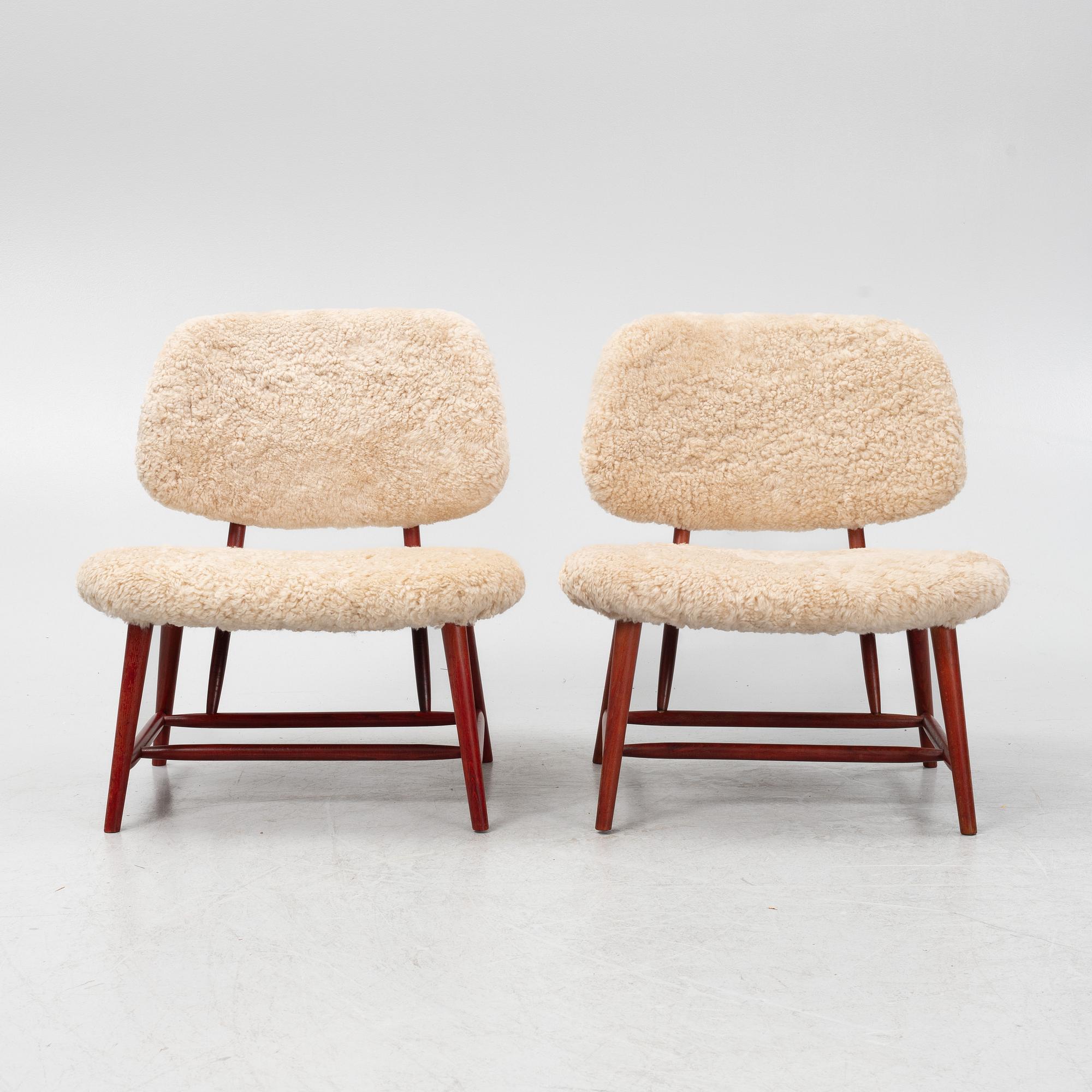 Alf Svensson, a pair of 'TeVe' easy chairs with new sheepskin upholstery, 1950s.