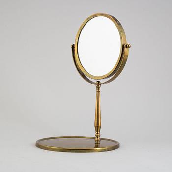 A mid 20th century brass and glass mirror.