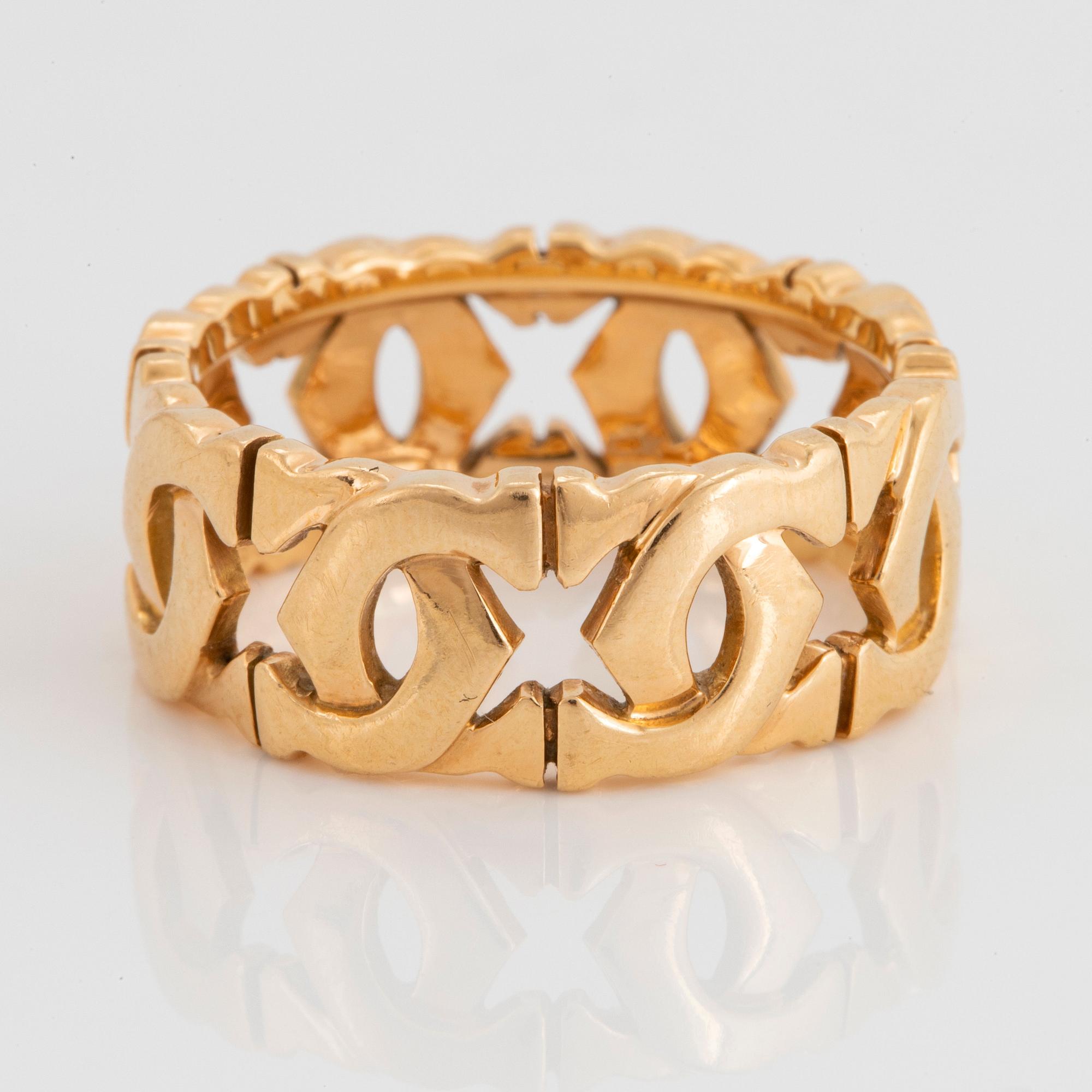 An 18K gold Cartier "Double C" ring.