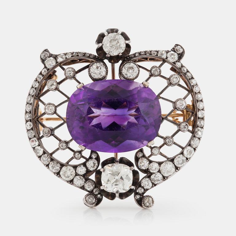 A BROOCH set with an amethyst and old-cut diamonds.