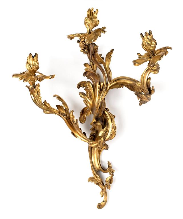A pair of Louis XV-style 19th century three-light wall-lights.