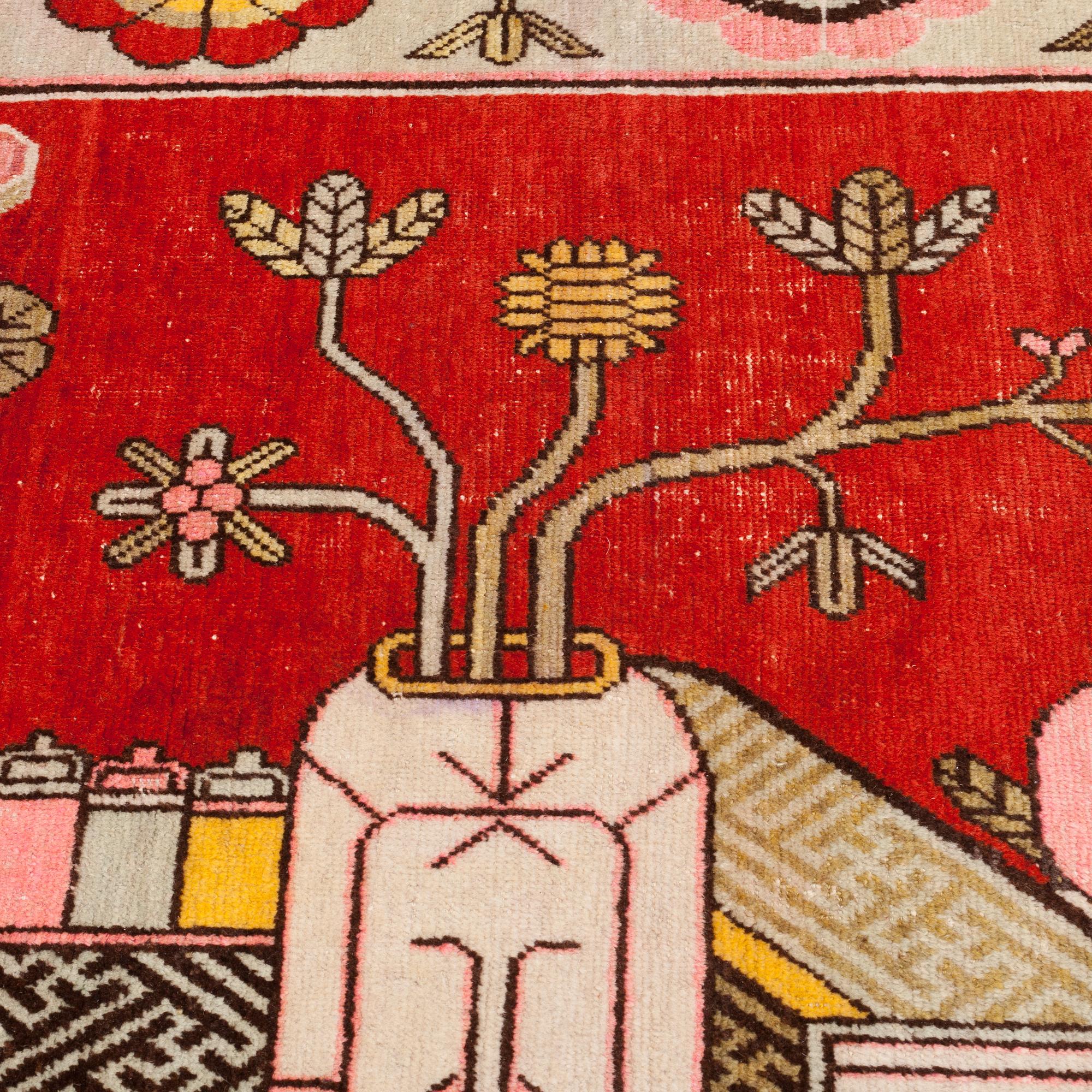 A CARPET, an antique/semi-antique Khotan figural, ca 259,5 x 160,5 cm.