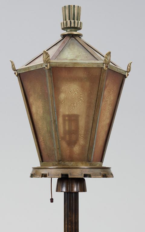 A 1930's floor lamp, the base of stained birch,