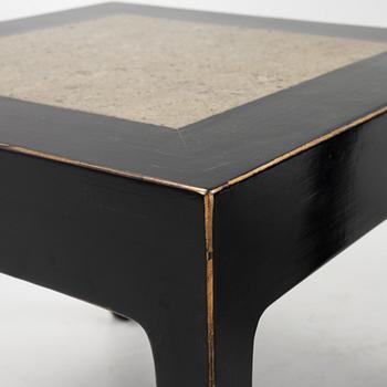 A pair of blac painted side tables with stone tops.